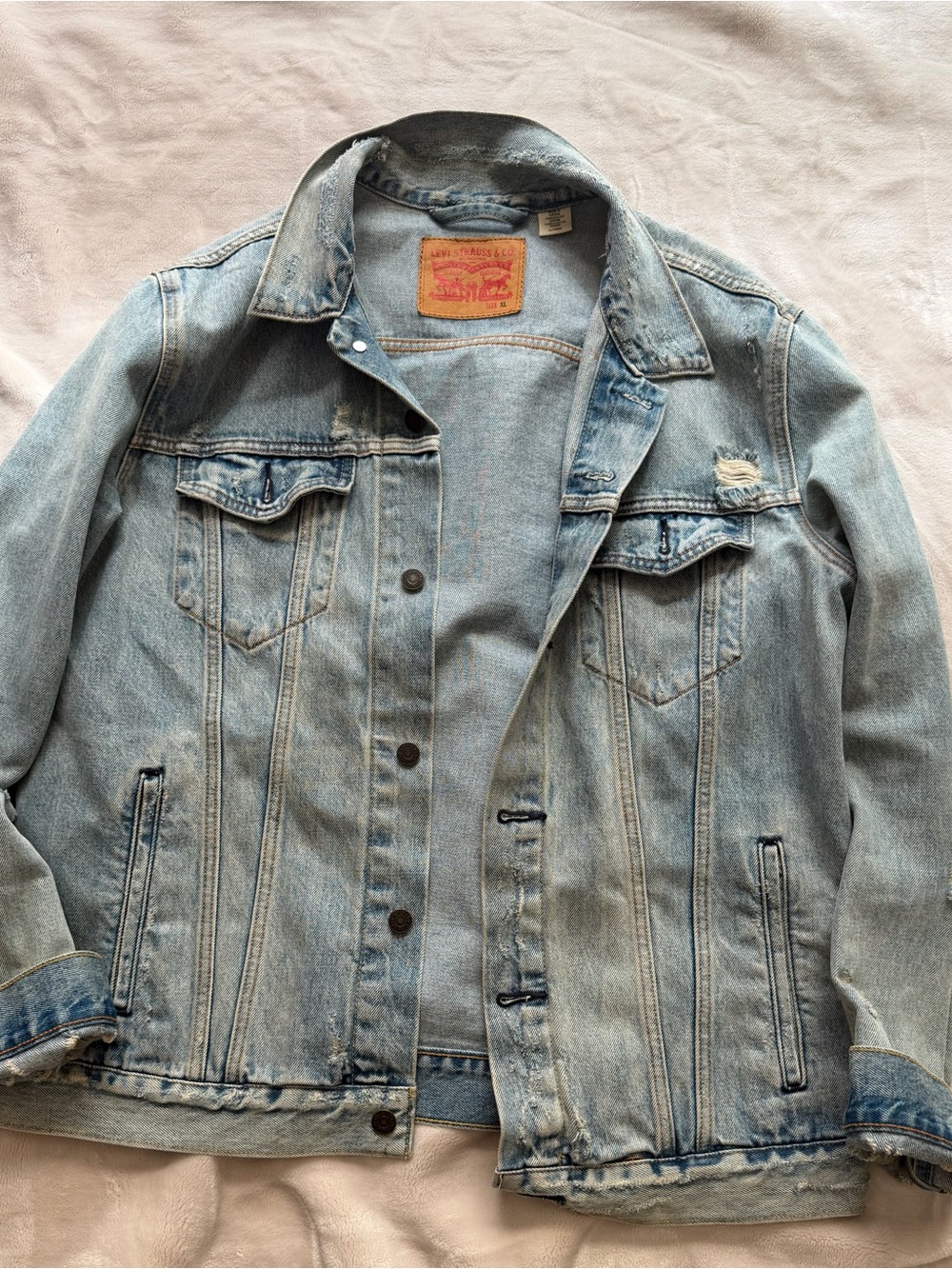 Levi's Light Blue Denim Trucker Jacket with Distressed Detail